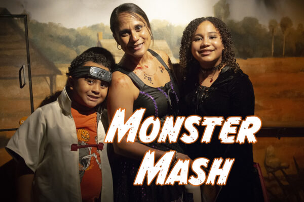 three people in costumes with monster mash text